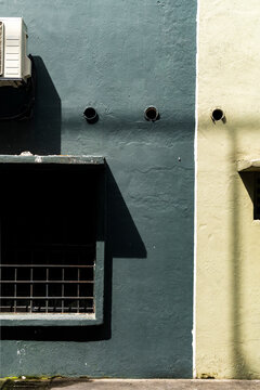 Mimalist architecture and blue and green textured walls with shadow