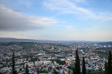 Fototapeta premium Cityscape of Tbilisi, the capital of Georgia, aerial panoramic view from Mtatsminda Park