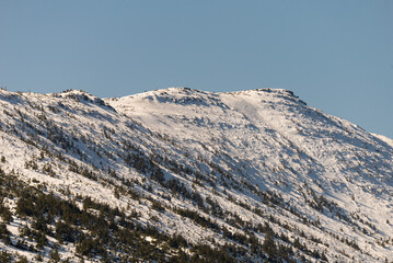 Mountain landscape in Poland. Babia Gora peak covered in winter snow. Babia Góra National Park.