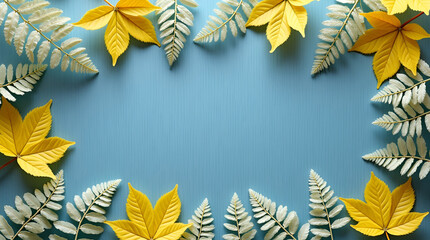 Flat lay of soft summer yellow leaves and delicate ferns forming a gentle natural frame