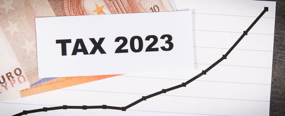 Inscription tax 2023, euro banknotes and rising graph showing tax increases. Calculating and paying tax
