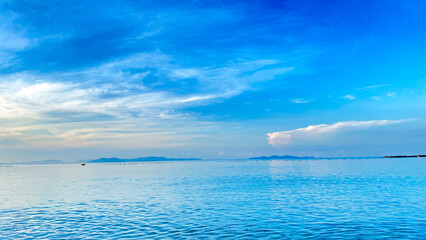 A tranquil seascape under a clear sky, reflecting peace, solitude, and natural beauty.