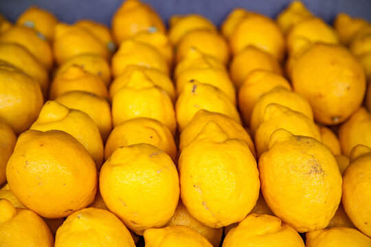Box of Lemons stacked outside fruit shop