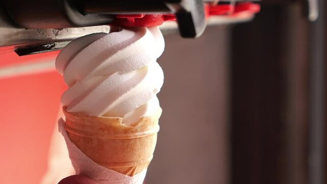 Enjoying creamy ice cream from a cone at a local parlor on a sunny day