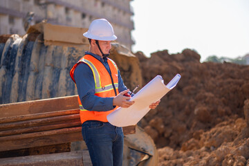 Construction surveyor or engineer working inspection damaged black corrugated pipe and construction...