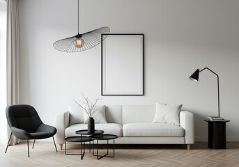 A living room with a white sofa black chair and tables and a lamp with a picture frame on the wall