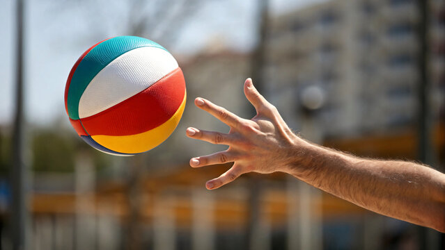 hand throwing a ball