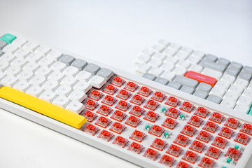 Mechanical keyboard with exposed red switches showing customization potential and internal design