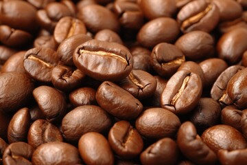 Naklejka premium Close-up of roasted coffee beans. Aromatic, rich, and freshly roasted beans. Ideal for brewing a flavorful cup of joe