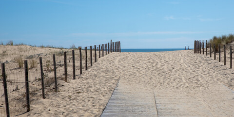 wooden pathway access wood path ocean sand dune grand crohot coast in lege cap-ferret of atlantic in France