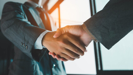 Trusted partner. Businessmen making handshake with partner, greeting, dealing, merger and...