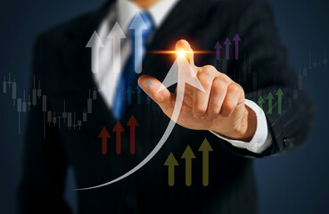 A businessman's confident finger points towards a rising upward trend line, symbolizing growth and...