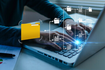 business people working document management system on laptop computer with graphic icon diagram on...