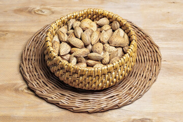 Inshell almonds in a wicker bowl