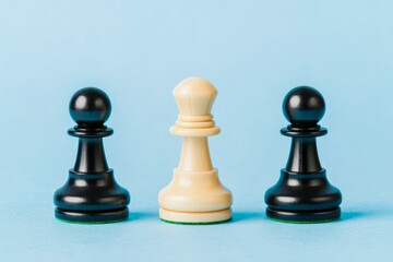 Three chess pawns in black and white on a blue background.