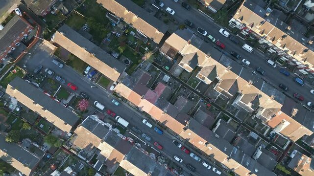 Aerial top down view of house roofs and gardens in Bootle, Liverpool, England, diagonal pattern