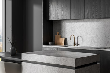 Modern minimalist kitchen interior with gray stone countertops, wooden cabinets, and brass faucet in natural lighting. 3D Rendering