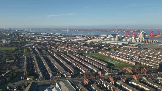 Residential housing in the borough of Bootle with industry in the background, Liverpool, England