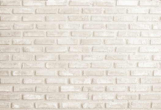 Detail of modern cream brick wall background photo. Brown light brick wall texture background for stone tile block painted in yellow light color wallpaper modern interior and exterior backdrop design.