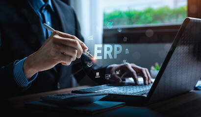 Business professional using ERP system for financial management and business operations, with digital icons representing enterprise resource planning, automation, and data integration