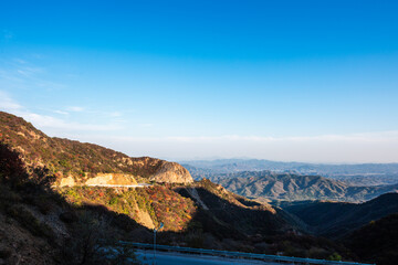 Mountain Road Landscape Under Sunny Sky
