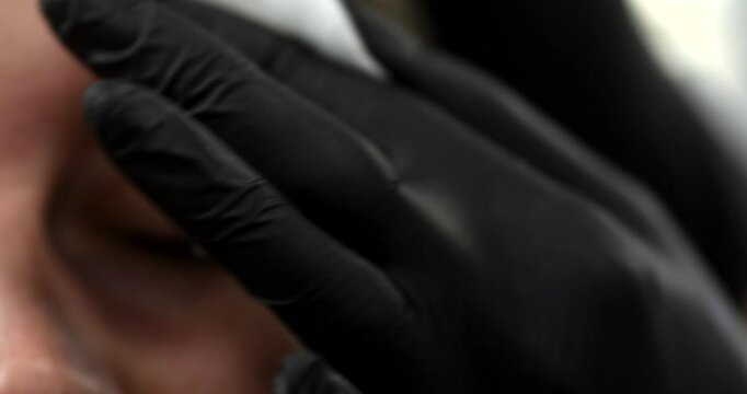 Hairdresser mixes natural dye for coloring hairs, coloring the eyebrows by henna, hair coloring at the beauty salon, beauty industry