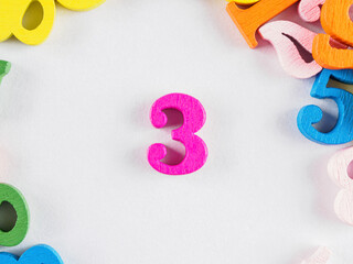 Bright close-up: the number 3. Powerful visual for lists, rankings, or celebrating “three.”