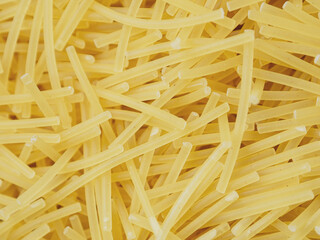 Close-up of small, thin vermicelli filini pasta. Delicate strands create a fine, textured food...