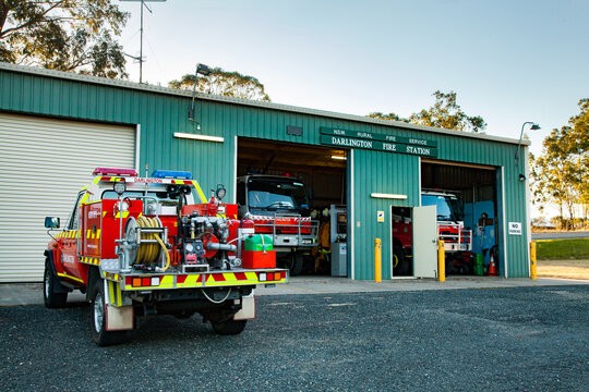 Small country fire truck parked at rural fire station ready for emergency