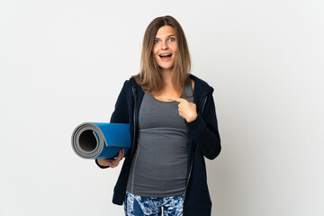 Slovak girl going to yoga classes isolated on white background with surprise facial expression