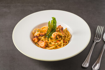 Linguine pasta with shrimp and seafood in tomato and garlic sauce