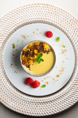 Mango pudding with chocolate and fresh fruit. Top view table.