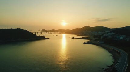Golden hour sunrise over a tranquil coastal bay.