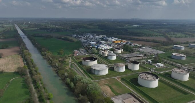 petroleum, gas, industrial storage silos, along the Wesel Datteln canal, Bucholtwelmen, Hunxe, Germany. Aerial view.