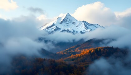 Snow Capped Mountain Peak with Cloud Inversion and Colorful Fall Forest