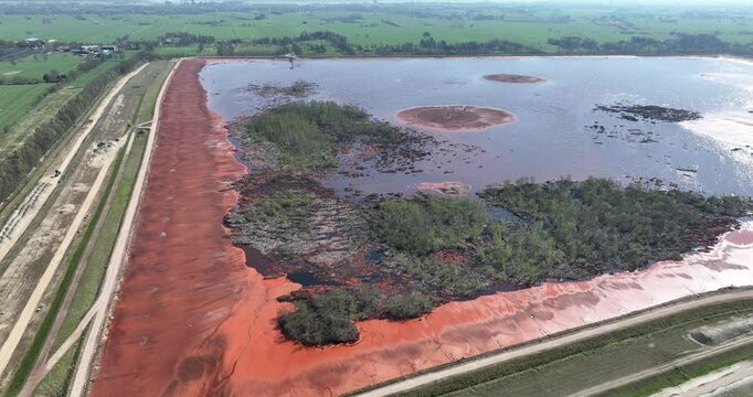 Red mud, bauxite residue, is an industrial waste generated during the processing of bauxite into alumina using the Bayer process.various oxide compounds, including the iron oxides which give its red