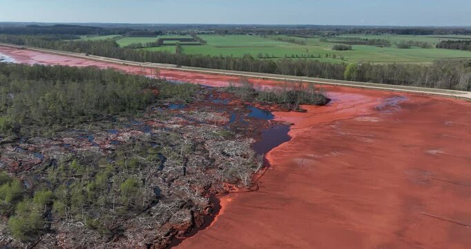 Red mud, bauxite residue, is an industrial waste generated during the processing of bauxite into alumina using the Bayer process.various oxide compounds, including the iron oxides which give its red