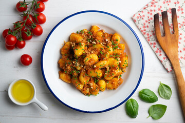 Dish of Italian gnocchi with tomato and meat Bolognese sauce. Top view table.