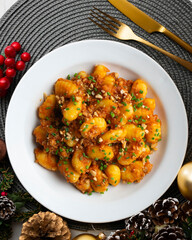 Dish of Italian gnocchi with tomato and meat Bolognese sauce. Top view table.