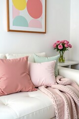 Elegant White Sofa with Pastel Cushions and Pink Knitted Blanket in Cozy Interior Decor, Ideal for Home Styling and Design Inspiration                