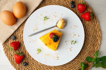Burnt Catalan custard tart with a biscuit base. Top view of a table.