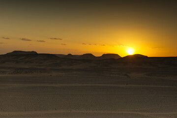 Sunset lights on the black desert in Egypt