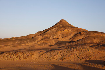 Sunset lights on the black desert in Egypt