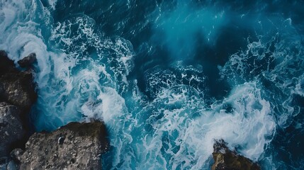 The ocean is calm and peaceful, with waves gently lapping against the rocks