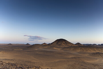 Sunset lights on the black desert in Egypt