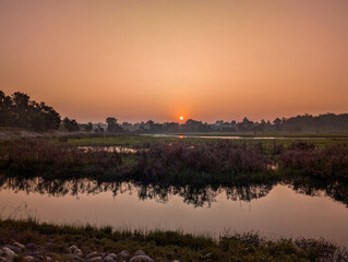 Obraz premium Serene Sunrise at Asan Barrage, Dehradun
