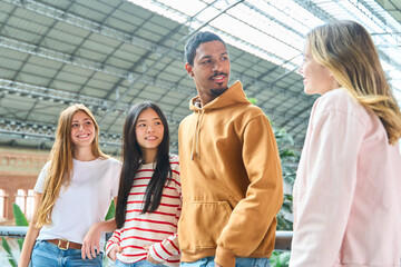 Group of multietnic people chatting together