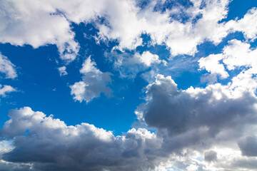 Cloudscape background. Partly cloudy blue sky view