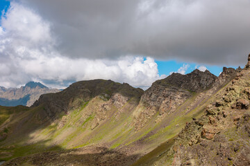 Mountain range with rolling clouds in the summer.
