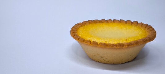 Egg tarts that are crispy on the outside and soft on the inside. Egg tarts that have a rich and creamy egg aroma. Egg tarts on white background.